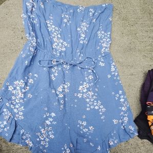 A heart strapless blue romper with small white flower small